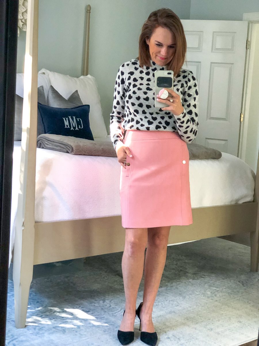 heart mock neck sweater paired with pink skirt 