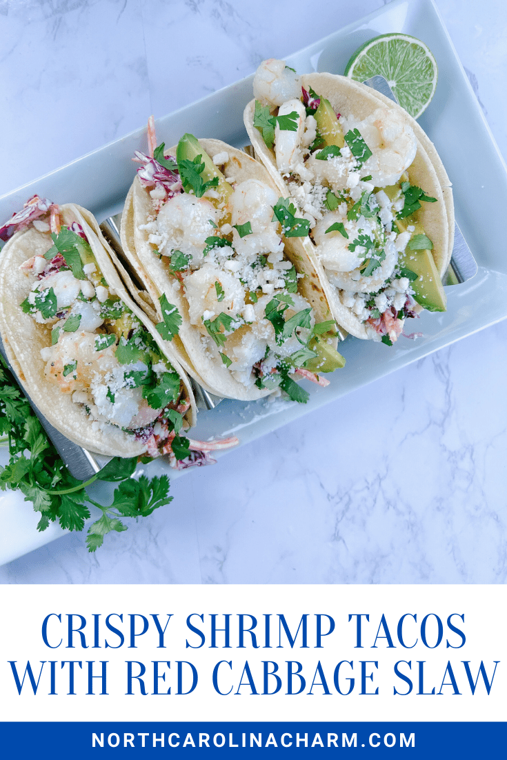 Need the best Crispy Shrimp Tacos recipe ever? Carolina Charm is sharing the most amazing Crispy Shrimp Tacos with red cabbage HERE!